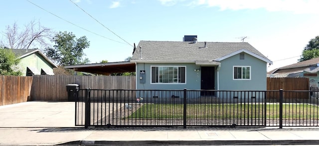 215 W Vine Ave, Visalia, CA 93291 - bungalow-style home with a front lawn, stucco siding, a shingled roof, a fenced front yard, and a carport