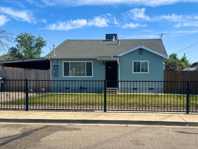 215 W Vine Ave, Visalia, CA 93291 - view of front of home featuring a fenced front yard, roof with shingles, central AC, a front lawn, and stucco siding