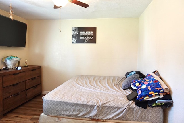 215 W Vine Ave, Visalia, CA 93291 - bedroom with dark wood-style flooring and ceiling fan