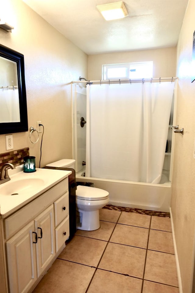 215 W Vine Ave, Visalia, CA 93291 - bathroom featuring vanity, backsplash, toilet, and shower / bath combination with curtain