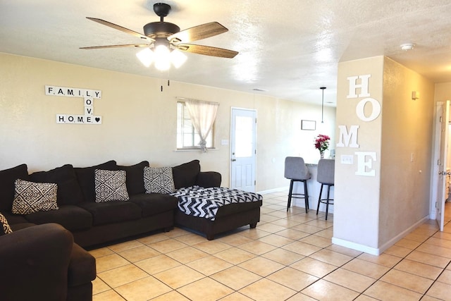 215 W Vine Ave, Visalia, CA 93291 - living room featuring baseboards, ceiling fan, and light tile patterned flooring