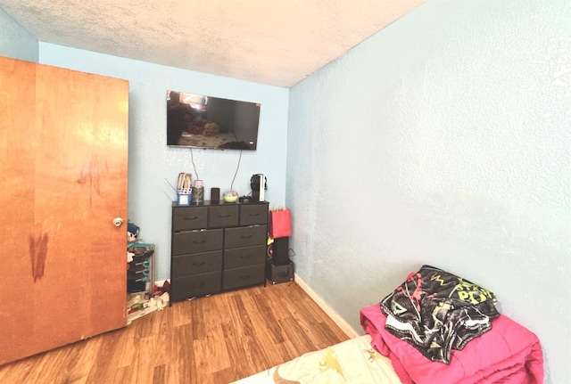 215 W Vine Ave, Visalia, CA 93291 - bedroom with baseboards and wood finished floors