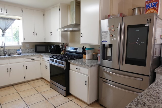 215 W Vine Ave, Visalia, CA 93291 - kitchen with wall chimney range hood, stainless steel appliances, white cabinetry, and a sink