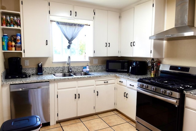 215 W Vine Ave, Visalia, CA 93291 - kitchen with wall chimney range hood, a sink, stainless steel appliances, white cabinetry, and light tile patterned floors