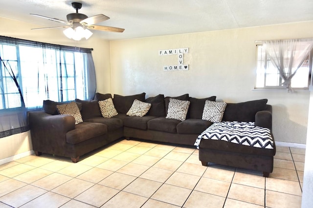 215 W Vine Ave, Visalia, CA 93291 - living room featuring baseboards, a ceiling fan, and light tile patterned floors
