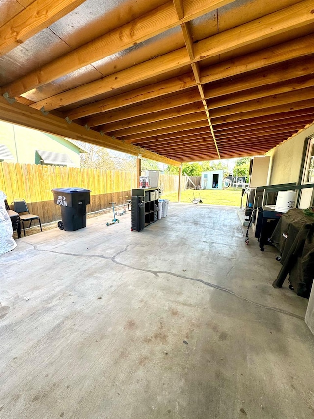 215 W Vine Ave, Visalia, CA 93291 - view of patio featuring an outdoor structure, a fenced backyard, and a shed
