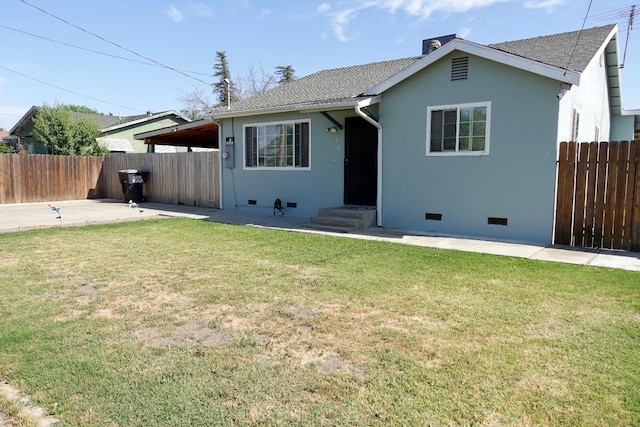 215 W Vine Ave, Visalia, CA 93291 - view of front of house featuring crawl space, a front yard, a patio area, fence, and stucco siding