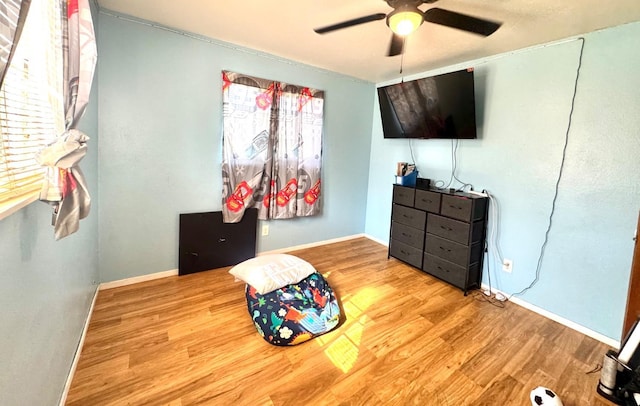 215 W Vine Ave, Visalia, CA 93291 - bedroom featuring baseboards, a ceiling fan, and wood finished floors