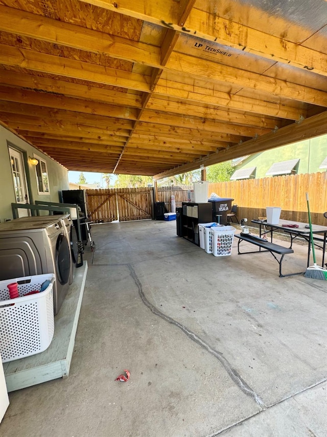 215 W Vine Ave, Visalia, CA 93291 - view of patio / terrace with a fenced backyard and washer / clothes dryer