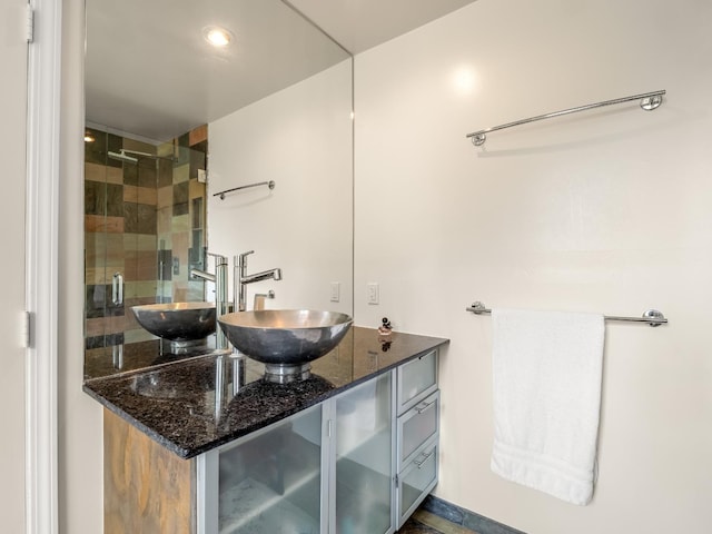 bathroom with vanity, recessed lighting, and a stall shower