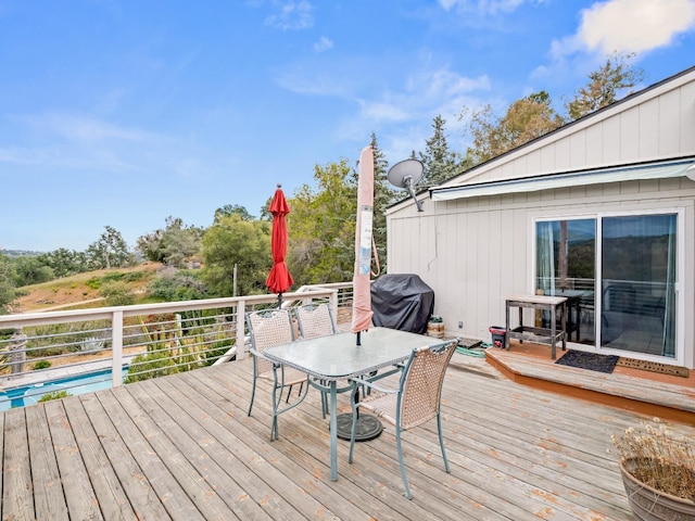 deck with outdoor dining space
