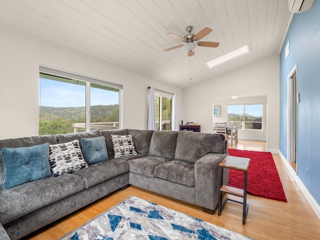 living area with plenty of natural light, wood ceiling, ceiling fan, and light wood-type flooring