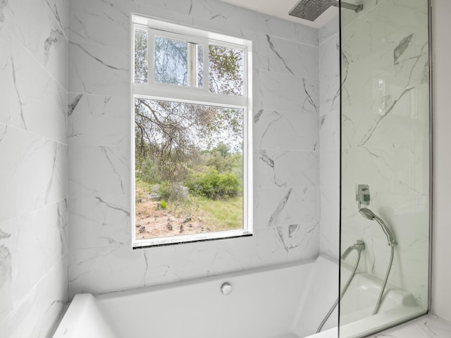 full bath with a marble finish shower