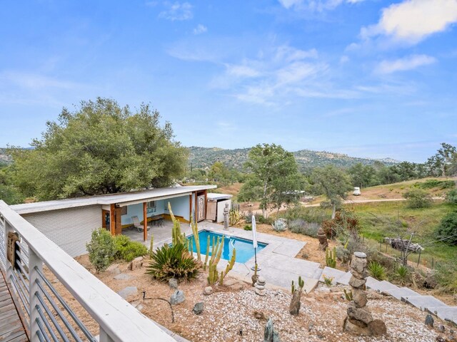 view of pool with a fenced in pool, fence, and a patio