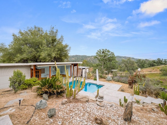outdoor pool featuring a patio area
