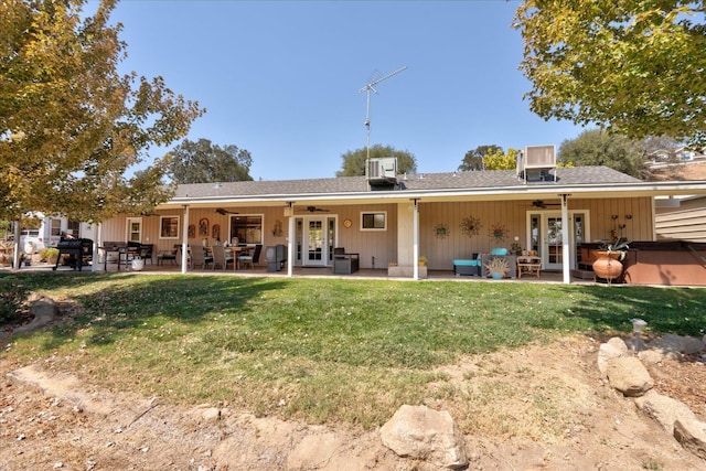 back of property featuring ceiling fan, a patio area, and french doors