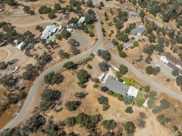 bird's eye view with view of desert and a rural view