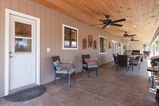 view of patio with a ceiling fan and outdoor dining space