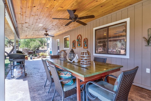 exterior space with ceiling fan and wooden ceiling