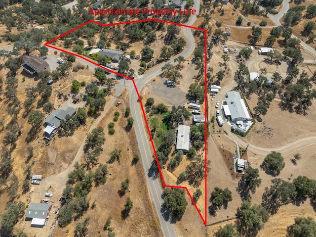 bird's eye view featuring view of desert and a rural view