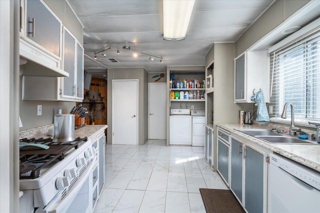 kitchen with open shelves, marble finish floor, white appliances, washer and clothes dryer, and a sink