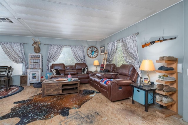living room with visible vents and a wealth of natural light