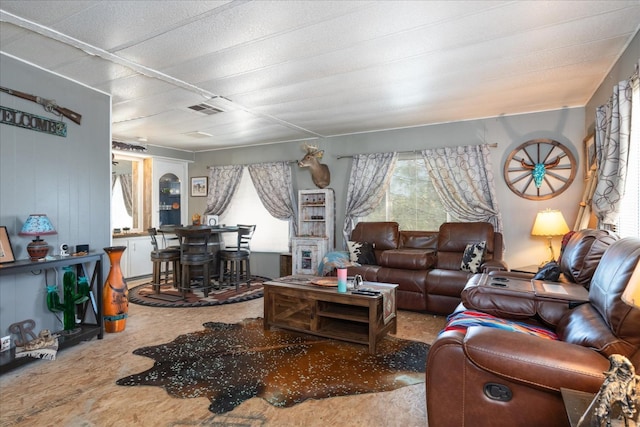 living room with visible vents and a wealth of natural light
