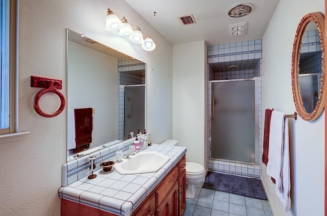 827 N Armstrong Ave, Clovis, CA 93611 - bathroom featuring toilet, a shower stall, and tile patterned floors