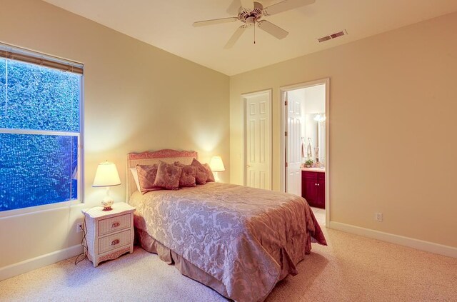 172 Omaha Ave, Clovis, CA 93619 - carpeted bedroom with baseboards, connected bathroom, and a ceiling fan