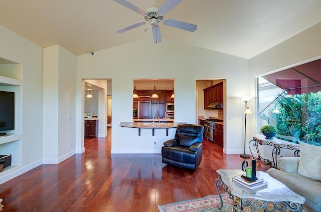 172 Omaha Ave, Clovis, CA 93619 - living room with dark wood-style flooring, ceiling fan, baseboards, and high vaulted ceiling
