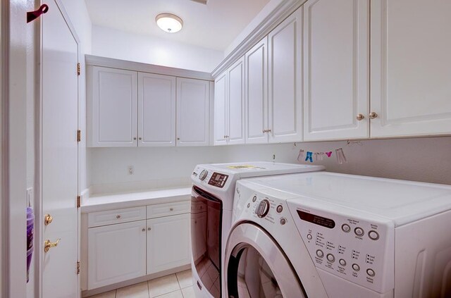 172 Omaha Ave, Clovis, CA 93619 - washroom with washing machine and dryer, cabinet space, and light tile patterned flooring
