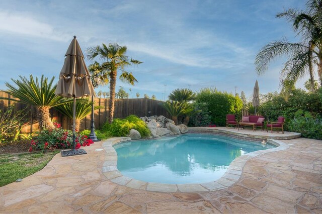 172 Omaha Ave, Clovis, CA 93619 - view of swimming pool featuring a patio area and a fenced backyard