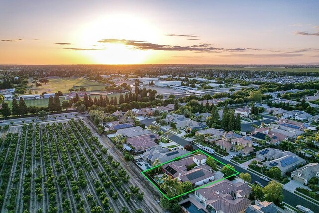 172 Omaha Ave, Clovis, CA 93619 - aerial view at dusk of property parcel outlined and a residential view
