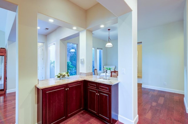 172 Omaha Ave, Clovis, CA 93619 - bar with dark wood finished floors, baseboards, decorative light fixtures, and recessed lighting