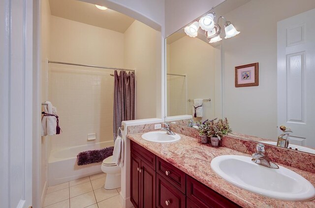 172 Omaha Ave, Clovis, CA 93619 - bathroom with toilet, tile patterned floors, double vanity, and shower / bathtub combination with curtain