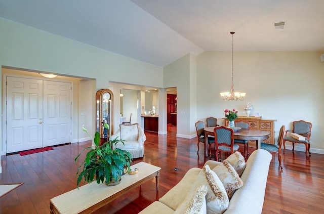 172 Omaha Ave, Clovis, CA 93619 - living area with a chandelier, baseboards, wood finished floors, and high vaulted ceiling