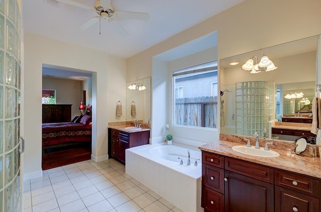 172 Omaha Ave, Clovis, CA 93619 - ensuite bathroom with a chandelier, a bath, a tile shower, tile patterned floors, and ceiling fan