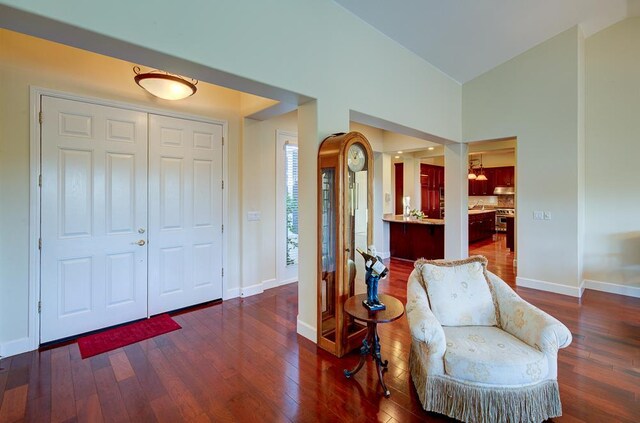 172 Omaha Ave, Clovis, CA 93619 - foyer entrance with hardwood / wood-style flooring, baseboards, and high vaulted ceiling