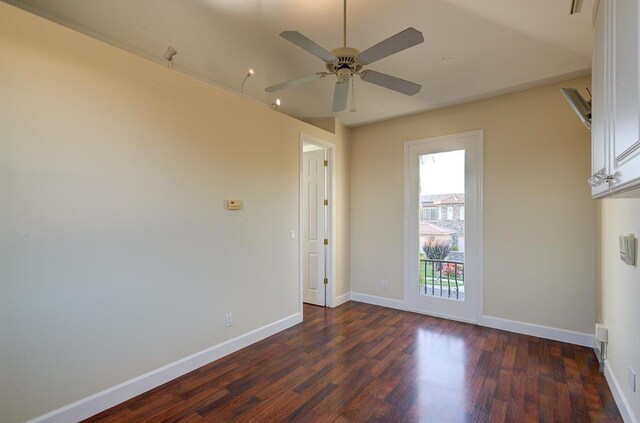 172 Omaha Ave, Clovis, CA 93619 - unfurnished room featuring dark wood-type flooring, ceiling fan, and baseboards