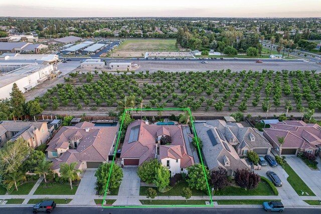 172 Omaha Ave, Clovis, CA 93619 - aerial perspective of suburban area featuring property boundaries highlighted and extensive farmland
