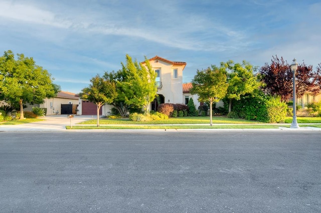 172 Omaha Ave, Clovis, CA 93619 - view of front of property featuring a tile roof, concrete driveway, and stucco siding