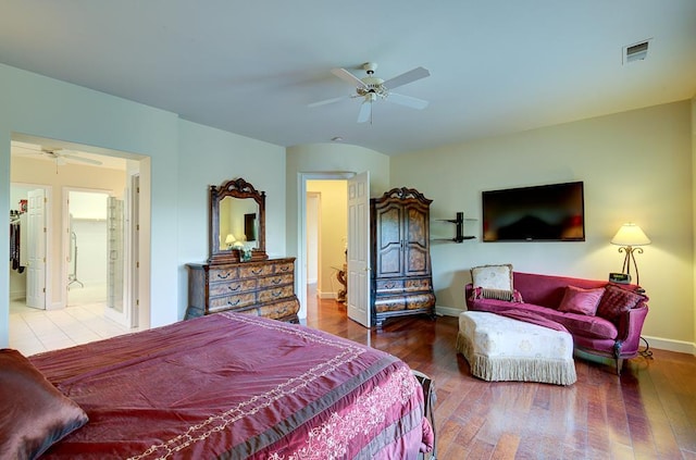 172 Omaha Ave, Clovis, CA 93619 - bedroom featuring wood finished floors, baseboards, ceiling fan, and ensuite bathroom