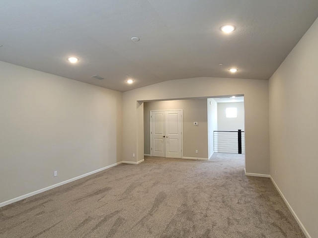 unfurnished room with baseboards, recessed lighting, carpet, and lofted ceiling