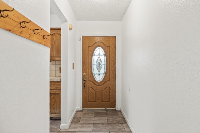 4462 N Manila Ave, Fresno, CA 93727 - entryway with wood finished floors and a textured ceiling