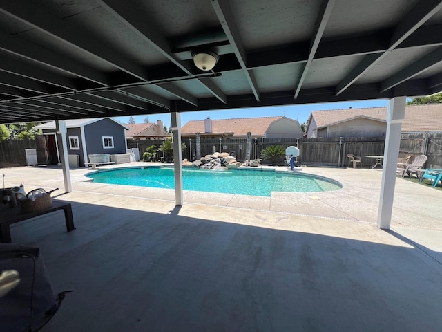 348 E Northridge, Dinuba, CA 93618 - view of pool with a fenced in pool, a fenced backyard, and an outbuilding