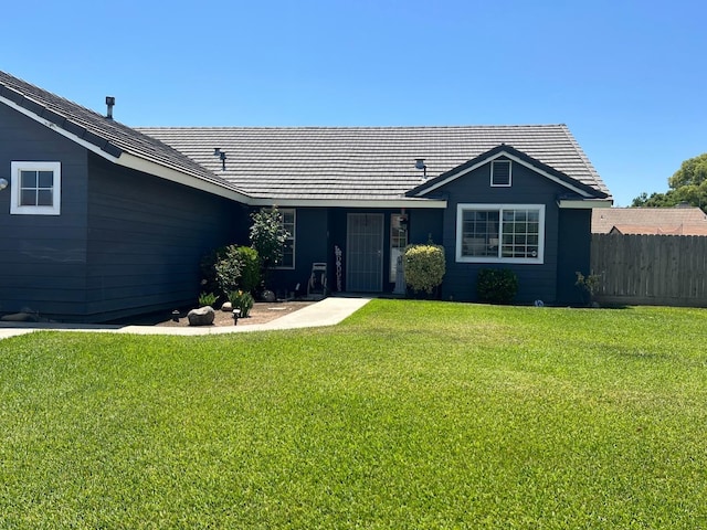 348 E Northridge, Dinuba, CA 93618 - single story home with fence, a tile roof, and a front lawn