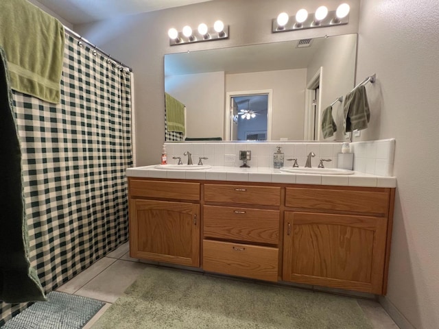 348 E Northridge, Dinuba, CA 93618 - full bathroom with a sink, tasteful backsplash, double vanity, and curtained shower