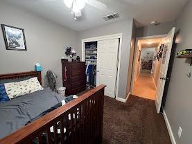 348 E Northridge, Dinuba, CA 93618 - bedroom with carpet floors, baseboards, visible vents, and a closet