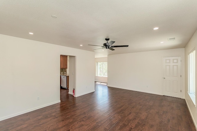 spare room with baseboards, ceiling fan, recessed lighting, and dark wood-type flooring