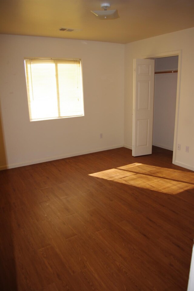 20204 Mini Ct, Tehachapi, CA 93561 - unfurnished bedroom featuring baseboards, visible vents, and wood finished floors